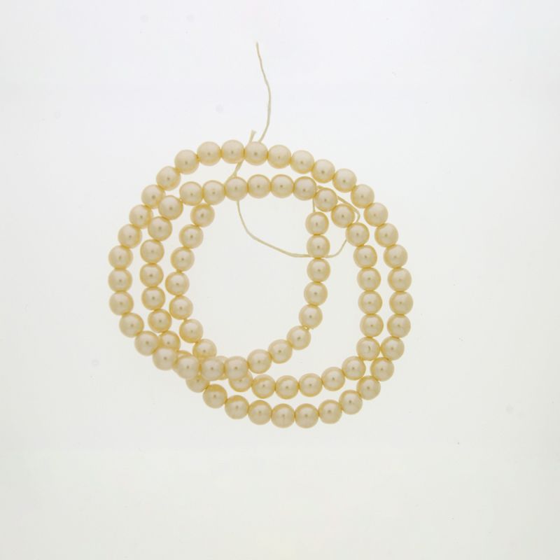 Perla cristal redonda Ø 3mm 2 agujeros. Color crema.
