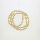 Perla cristal redonda Ø 3mm 2 agujeros. Color crema.