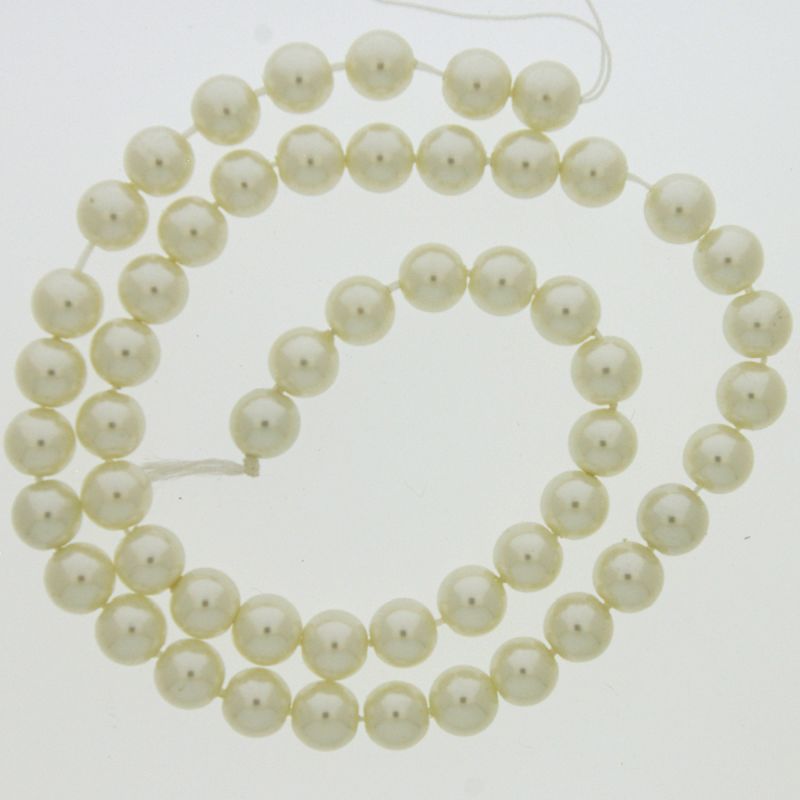 Perla cristal redonda Ø 6mm 2 agujeros. Color crema.
