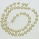 Perla cristal redonda Ø 6mm 2 agujeros. Color crema.