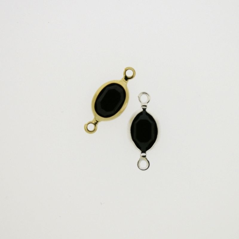 Entrepieza con strass ovalado 6x8mm color negro. Longitud 16mm
