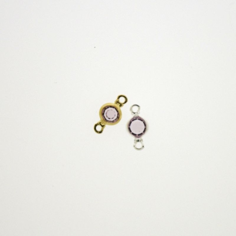 Entrepieza con strass redondo diam. 5mm color amatista claro. Longitud 9mm