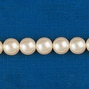 Perle en verre ronde Ø 7mm 2 trous. Couleur crème.